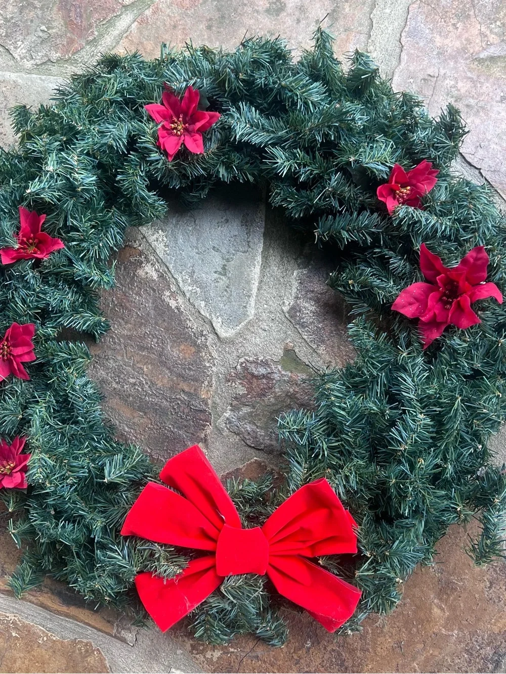 Festive Green Holiday Wreath with Red Bow and Poinsettias